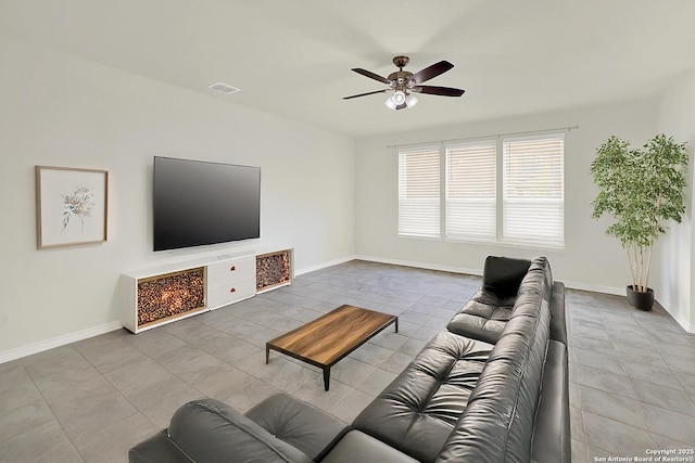 tiled living room featuring ceiling fan