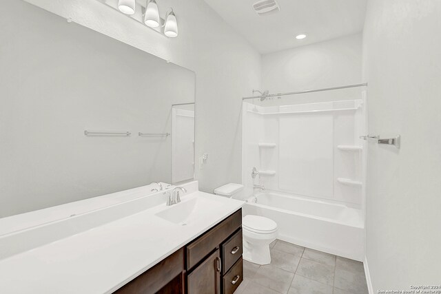 full bathroom with shower / washtub combination, tile patterned floors, vanity, and toilet