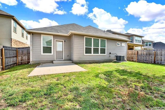 back of house with a patio, central AC unit, and a yard