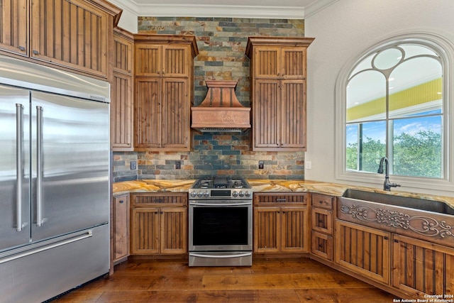 kitchen featuring stainless steel appliances, dark wood finished floors, and crown molding