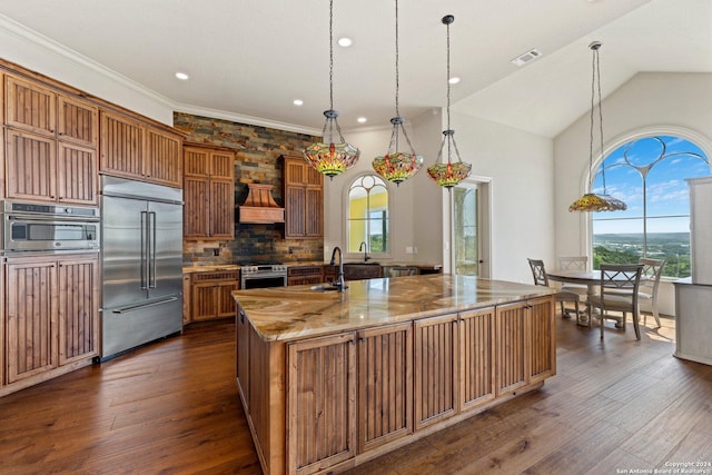 kitchen with stainless steel appliances, visible vents, a sink, and dark wood-style floors