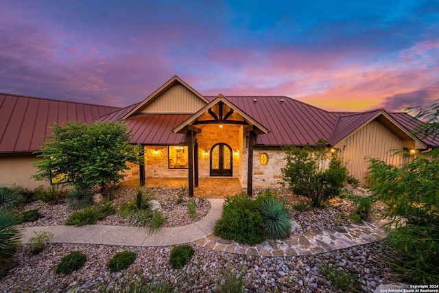 view of front of home with metal roof and a standing seam roof