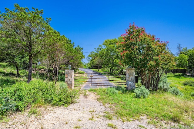 view of gate featuring fence