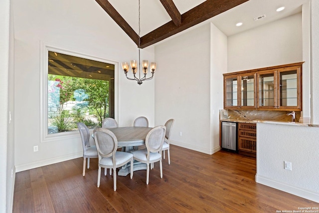 dining space with dark wood-style flooring, beam ceiling, a notable chandelier, visible vents, and baseboards