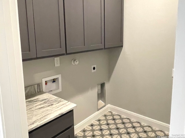 washroom featuring hookup for a washing machine, cabinets, and electric dryer hookup