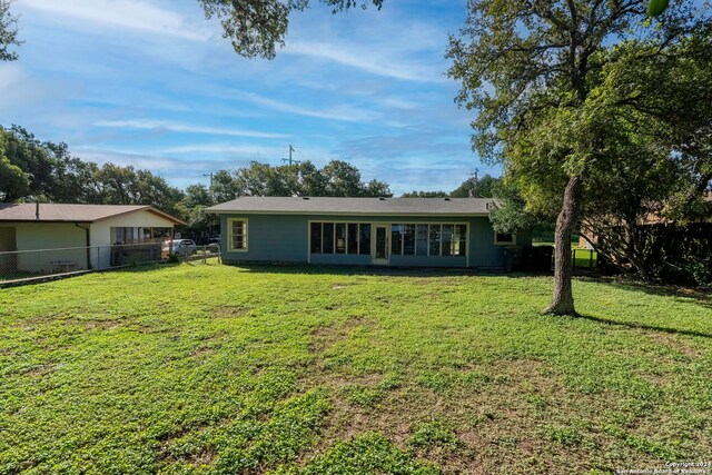 back of house with a yard