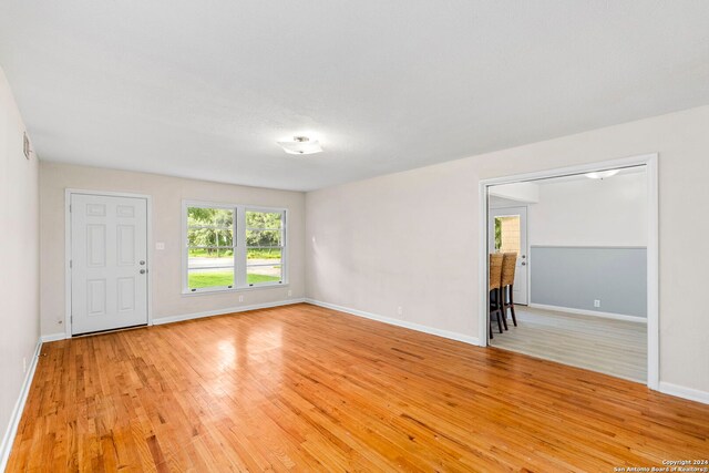 unfurnished room featuring light wood-type flooring