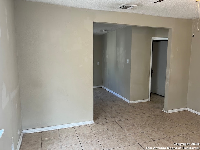 spare room featuring a textured ceiling