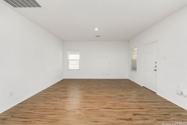 interior space with light wood-type flooring and visible vents