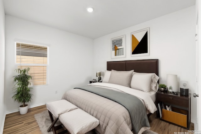 bedroom featuring recessed lighting, baseboards, and wood finished floors