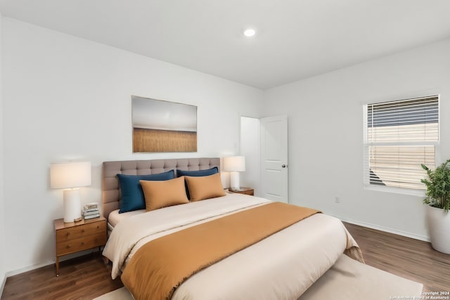 bedroom with recessed lighting, baseboards, and wood finished floors