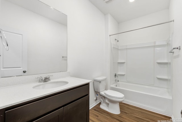 bathroom with shower / bathtub combination, toilet, wood finished floors, vanity, and visible vents