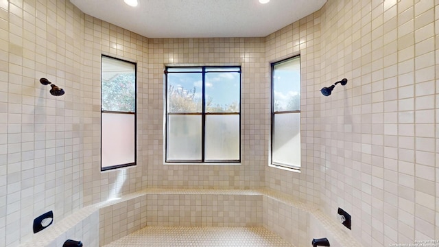 bathroom with tile walls