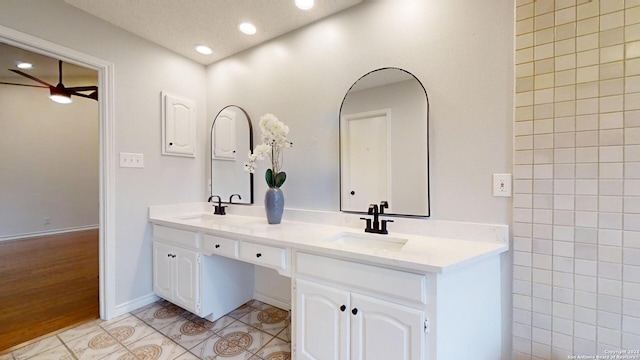 bathroom featuring ceiling fan, vanity, and tile patterned flooring