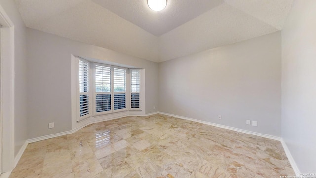 empty room with a textured ceiling