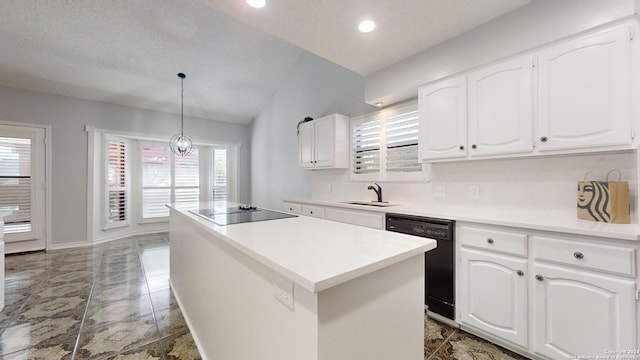 kitchen with black appliances, hanging light fixtures, a wealth of natural light, and white cabinets