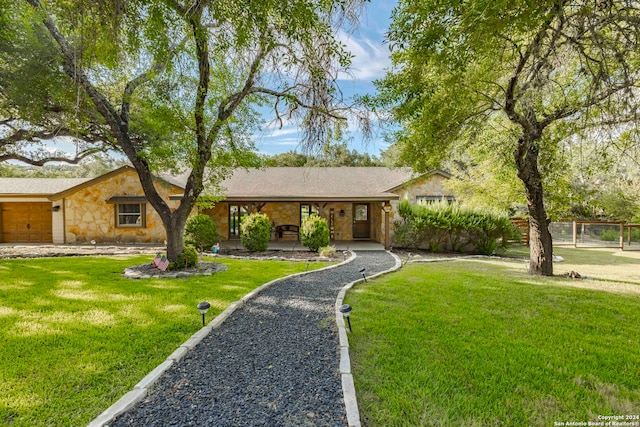 ranch-style house with a front lawn