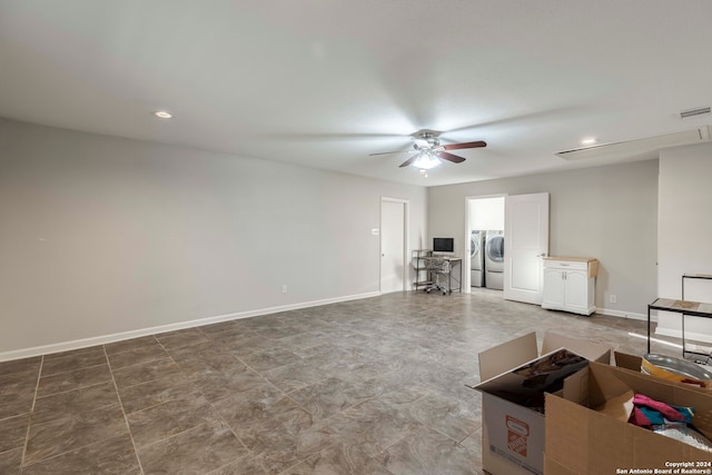 living room featuring ceiling fan, washer and clothes dryer, and tile patterned flooring