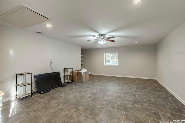 unfurnished living room with ceiling fan and tile patterned floors