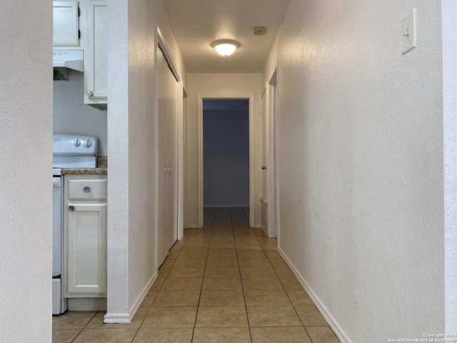 hallway with light tile patterned flooring