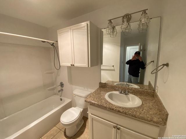 full bath with shower / bathtub combination, toilet, vanity, and tile patterned flooring