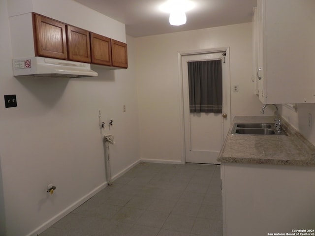 interior space with sink and tile patterned flooring