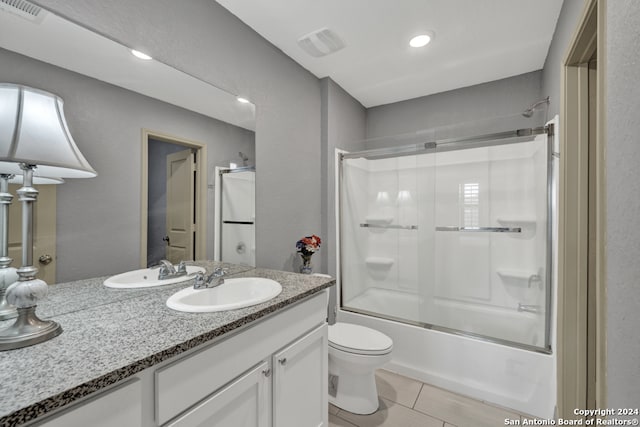 full bathroom featuring tub / shower combination, toilet, tile patterned floors, and vanity