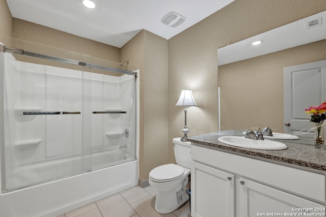 full bathroom featuring tile patterned floors, vanity, washtub / shower combination, and toilet