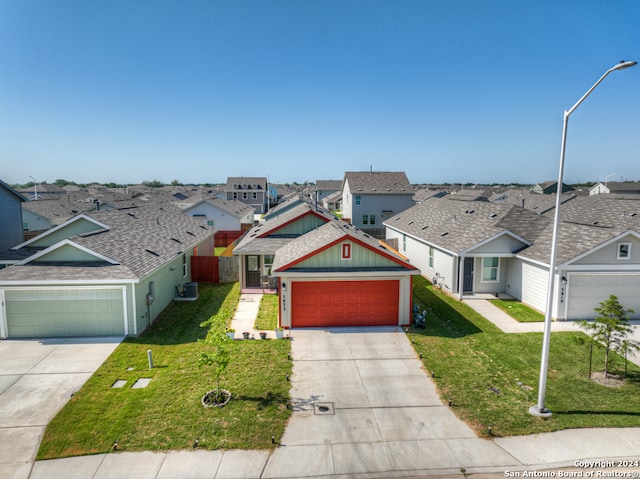 view of front of home featuring a front lawn and a garage