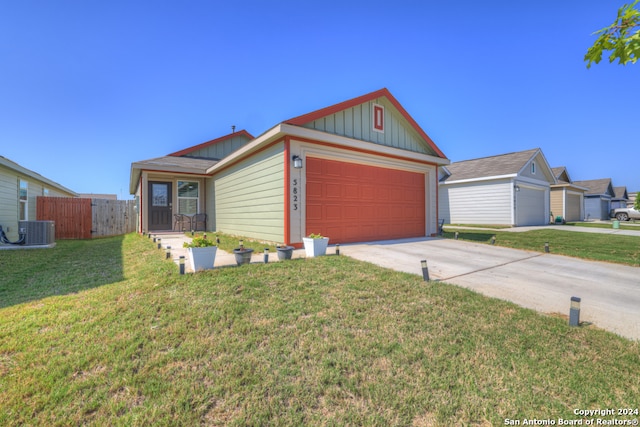 single story home featuring a front yard, central AC unit, and a garage