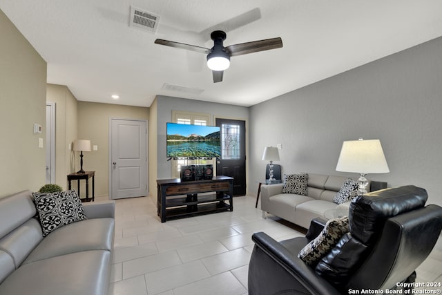 tiled living room featuring ceiling fan