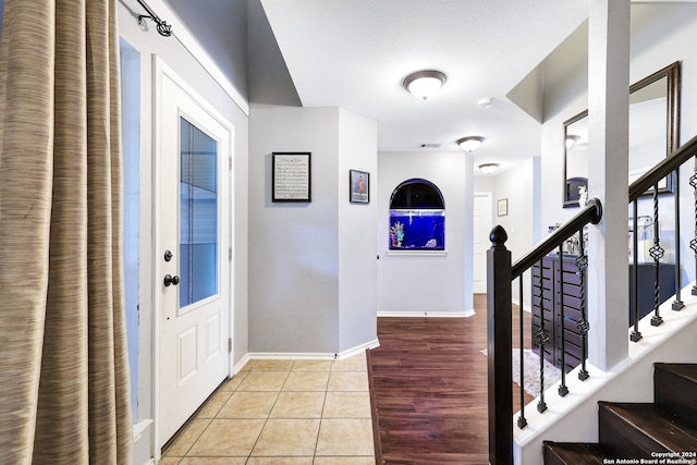 foyer entrance with light hardwood / wood-style floors