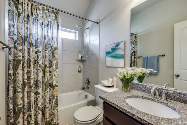 full bathroom with vanity, shower / bath combo, and toilet