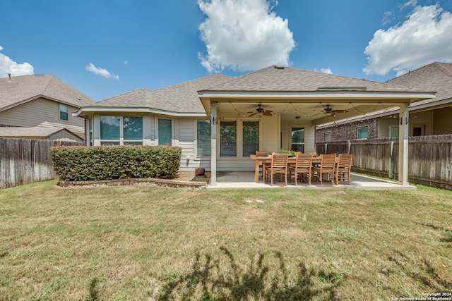 back of house featuring ceiling fan, a lawn, and a patio