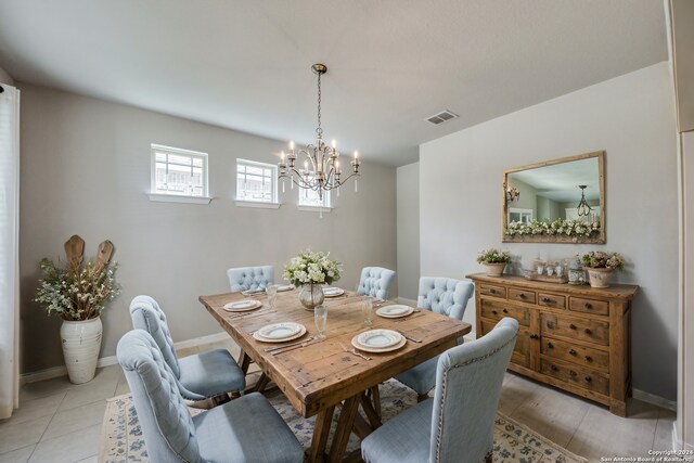 kitchen with appliances with stainless steel finishes, sink, tasteful backsplash, and an island with sink