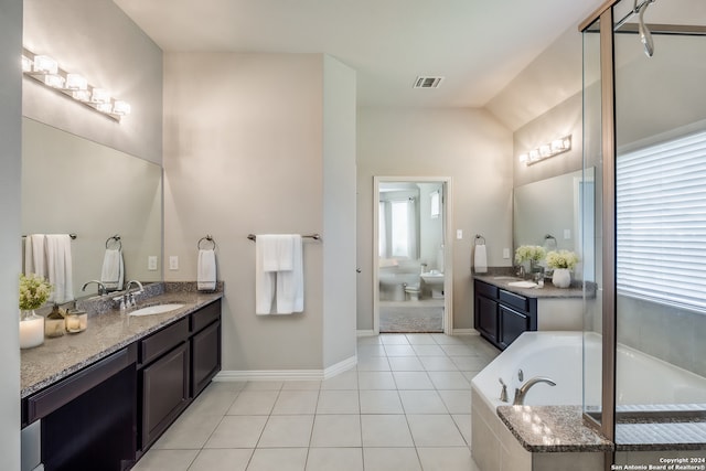 bathroom featuring a bidet, a relaxing tiled tub, tile patterned flooring, and a healthy amount of sunlight