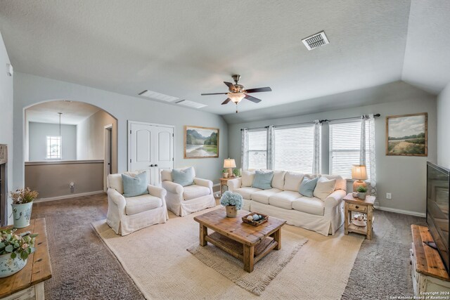 bedroom featuring carpet flooring, vaulted ceiling, and ceiling fan