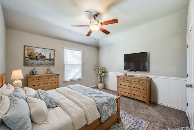 bedroom with lofted ceiling, light carpet, and ceiling fan