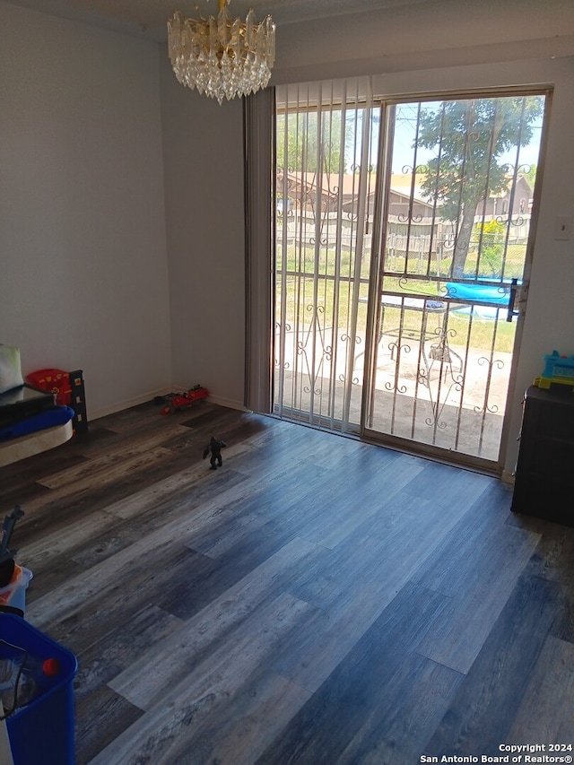 interior space with hardwood / wood-style flooring and a chandelier