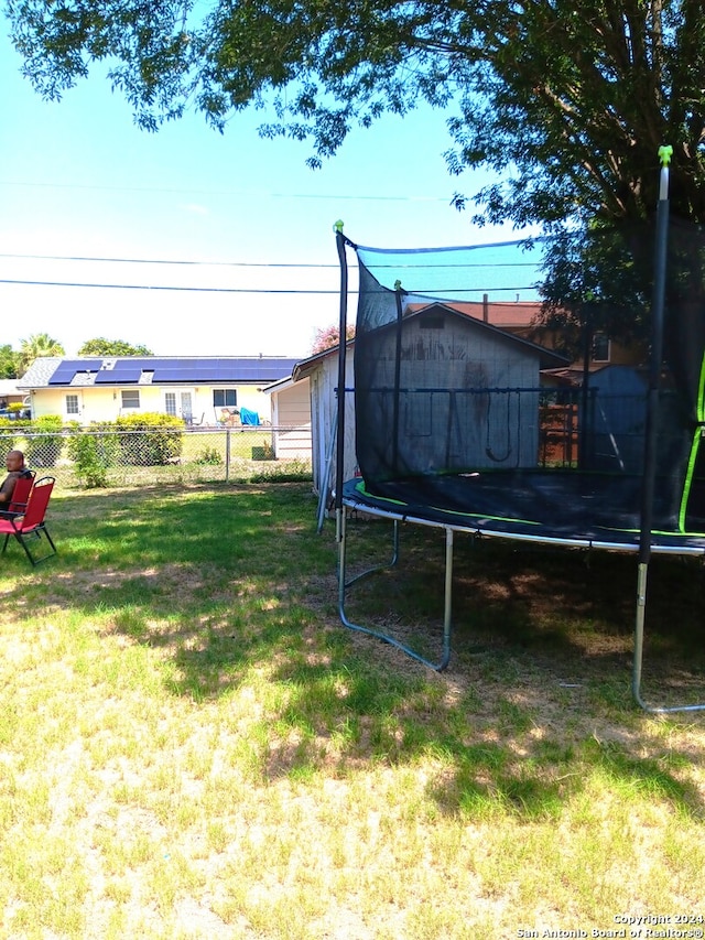 view of yard with a trampoline