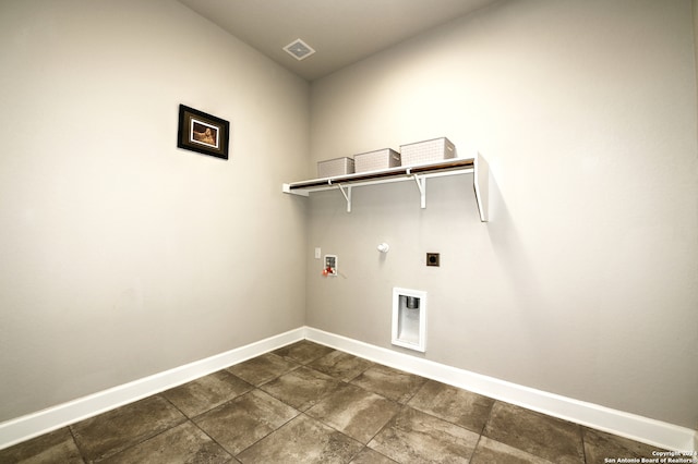 washroom with gas dryer hookup, washer hookup, electric dryer hookup, and dark tile patterned floors