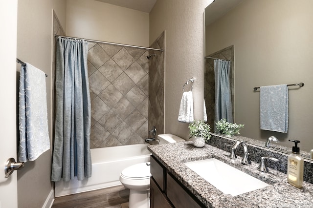 full bathroom with vanity, shower / bathtub combination with curtain, and toilet