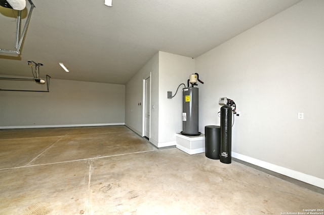 garage featuring water heater and a garage door opener