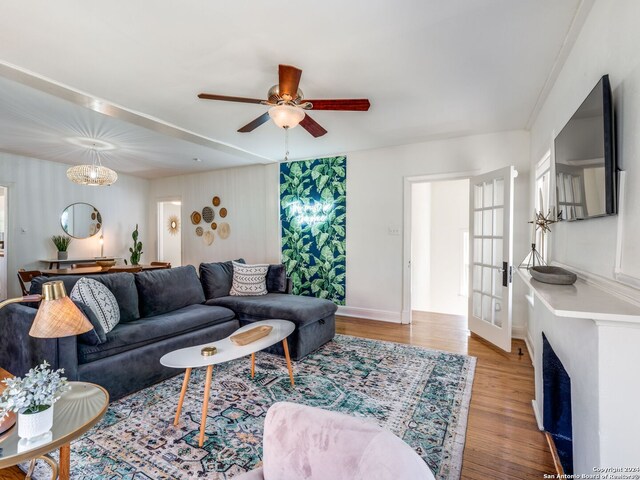 living room featuring french doors, hardwood / wood-style floors, and ceiling fan