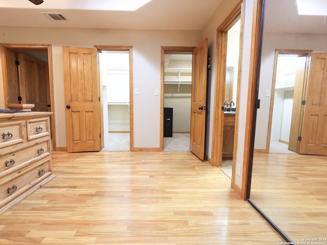 hall with light hardwood / wood-style floors