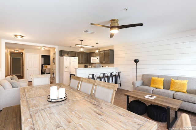 dining room with ceiling fan, washer / clothes dryer, and light tile patterned floors