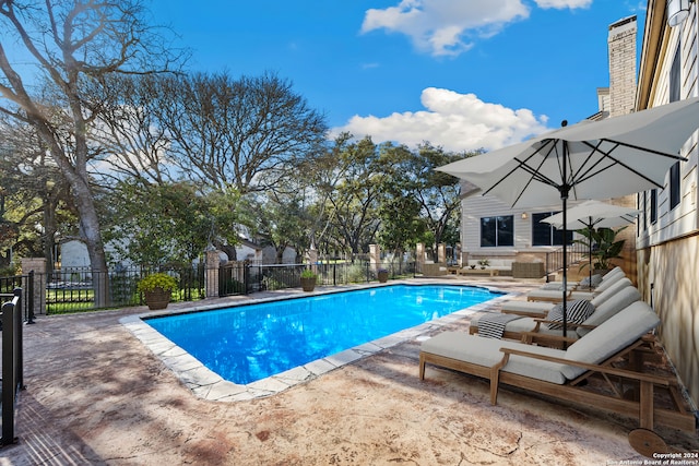 view of swimming pool with a patio