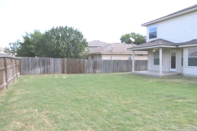 view of yard featuring a fenced backyard and a patio