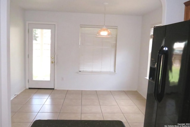 interior space with light tile patterned floors