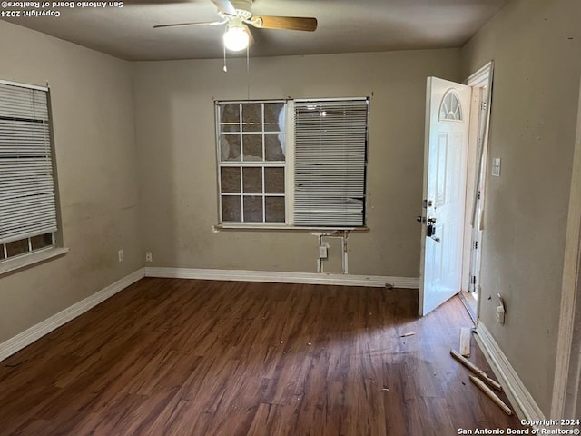 unfurnished room with ceiling fan and hardwood / wood-style flooring